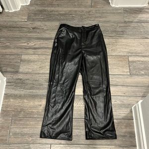 Woman’s black leather pants